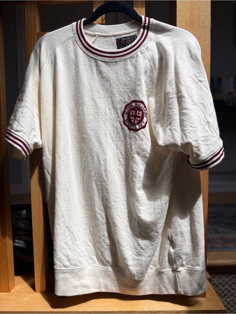 Cream Short Sleeve Tee with Maroon Trim and Crest